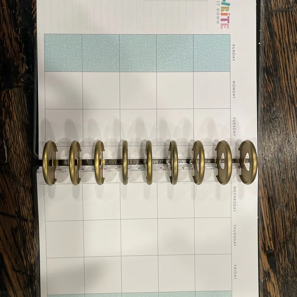 The Happy Planner Colorful Wave Calendar -mix of pages, rings, monthly dividers.